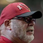A 9/11 memorial pin is seen on the cap of Arizona Cardinals head coach Bruce Arians prior to an NFL football game against the New England Patriots, Sunday, Sept. 11, 2016, in Glendale, Ariz. (AP Photo/Rick Scuteri)