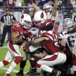 New England Patriots running back LeGarrette Blount (29) pushes across the goal line for a touchdown as Arizona Cardinals free safety Tyrann Mathieu (32) defends during the second half of an NFL football game, Sunday, Sept. 11, 2016, in Glendale, Ariz. (AP Photo/Rick Scuteri)