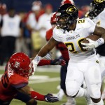 Grambling State running back Jestin Kelly (28) stiff arms Arizona safety Anthony Mariscal (25) during the first half of an NCAA college football game, Saturday, Sept. 10, 2016, in Tucson, Ariz. (AP Photo/Rick Scuteri)