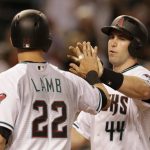 Arizona Diamondbacks Paul Goldschmidt (44) celebrates with  Jake Lamb after hitting a two-run home run against the San Diego Padres in the third inning during a baseball game, Friday, Sept. 30, 2016, in Phoenix. (AP Photo/Rick Scuteri)