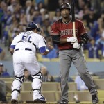 Los Angeles Dodgers catcher Carlos Ruiz, left, reacts after Arizona Diamondbacks' Rickie Weeks Jr. made the final out in the top of the seventh inning during a baseball game, Wednesday, Sept. 7, 2016, in Los Angeles. (AP Photo/Jae C. Hong)