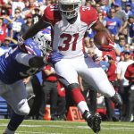 Arizona Cardinals running back David Johnson (31) gets past Buffalo Bills defensive end Adolphus Washington (92) during the first half of an NFL football game on Sunday, Sept. 25, 2016, in Orchard Park, N.Y. (AP Photo/Jeffrey T. Barnes)