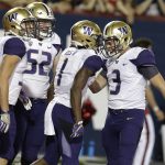 Washington wide receiver John Ross (1) celebrates with Jake Browning (3) after scoring a first-half touchdown during an NCAA college football game against Arizona, Saturday, Sept. 24, 2016, in Tucson, Ariz. (AP Photo/Rick Scuteri)