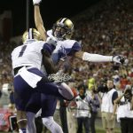 Washington wide receiver John Ross (1) celebrates with Dante Pettis after scoring a touchdown during the first half of an NCAA college football game against Arizona, Saturday, Sept. 24, 2016, in Tucson, Ariz. (AP Photo/Rick Scuteri)
