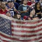 Arizona Cardinals fans cheer during the first half of an NFL football game against the  New England Patriots, Sunday, Sept. 11, 2016, in Glendale, Ariz. (AP Photo/Ross D. Franklin)