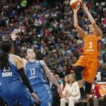 Phoenix Mercury's Diana Taurasi, right, shoots over Minnesota Lynx defenders Lindsay Whalen, center, and Maya Moore in the second half of a WNBA playoff semi-finals basketball game Wednesday, Sept. 28, 2016, in St. Paul, Minn. The Lynx won 113-95. (AP Photo/Jim Mone)