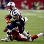 New England Patriots running back James White (28) is hit by Arizona Cardinals free safety Tyrann Mathieu (32) during an NFL football game, Sunday, Sept. 11, 2016, in Glendale, Ariz. (AP Photo/Ross D. Franklin)