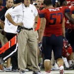 Arizona coach Rich Rodriguez stares down Cody Ippolito (57) after Ippolito was ejected from the NCAA college football game, during the second half against Grambling State, Saturday, Sept. 10, 2016, in Tucson, Ariz. Arizona defeated Grambling State 31-21. (AP Photo/Rick Scuteri)