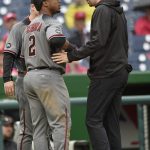 Arizona Diamondbacks' Jean Segura (2) is tended to by a trainer during his at-bat during the seventh inning of a baseball game against the Washington Nationals, Thursday, Sept. 29, 2016, in Washington. Segura left the game with an injury. (AP Photo/Nick Wass)