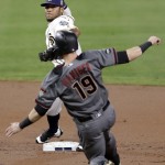 San Diego Padres second baseman Alexi Amarista throws to first too late for a double play as Arizona Diamondbacks' Mitch Haniger (19) slides in late during the second inning of a baseball game Monday, Sept. 19, 2016, in San Diego. (AP Photo/Gregory Bull)