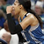 Minnesota Lynx's Maya Moore cheers her team on during a break on the bench in the second half of a WNBA playoff semi-finals basketball game against the Phoenix Mercury Wednesday, Sept. 28, 2016, in St. Paul, Minn. Moore led the Lynx with 31 points in their 113-95 win. (AP Photo/Jim Mone)