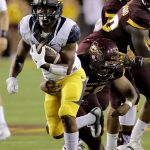 California running back Tre Watson carries the ball as Arizona State linebacker Salamo Fiso (58) makes the tackle during the first half of an NCAA college football game, Saturday, Sept. 24, 2016, in Tempe, Ariz. (AP Photo/Matt York)