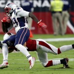 New England Patriots running back LeGarrette Blount (29) is hit by Arizona Cardinals defensive back Tyvon Branch (27) during an NFL football game, Sunday, Sept. 11, 2016, in Glendale, Ariz. (AP Photo/Ross D. Franklin)