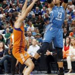 Minnesota Lynx's Maya Moore, right, shoots as Phoenix Mercury's Nirra Fields defends in the first quarter of a WNBA playoff semi-finals basketball game Wednesday, Sept. 28, 2016, in St. Paul, Minn. (AP Photo/Jim Mone)