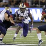 Washington running back Lavon Coleman carries the ball during the first half of an NCAA college football game against Arizona, Saturday, Sept. 24, 2016, in Tucson, Ariz. (AP Photo/Rick Scuteri)