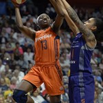 Connecticut Sun's Chiney Ogwumike, left, shoots as Phoenix Mercury's Candice Dupree, right, defends during the first half of a WNBA basketball game, Friday, Sept. 2, 2016, in Uncasville, Conn. (AP Photo/Jessica Hill)