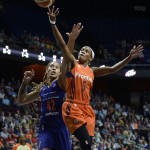 Connecticut Sun's Jasmine Thomas shoots as Phoenix Mercury's Brittney Griner, left, defends during the first half of a WNBA basketball game, Friday, Sept. 2, 2016, in Uncasville, Conn. (AP Photo/Jessica Hill)