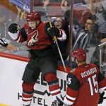 Arizona Coyotes' Michael Bunting (58) celebrates his goal against the Los Angeles Kings with Brad Richardson (15) during the third period of a preseason NHL hockey game Monday, Sept. 26, 2016, in Glendale, Ariz. The Coyotes defeated the Kings 5-3. (AP Photo/Ross D. Franklin)