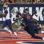 Washington wide receiver John Ross, left, scores a touchdown against Arizona during the first half of an NCAA college football game, Saturday, Sept. 24, 2016, in Tucson, Ariz. (AP Photo/Rick Scuteri)