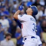 Los Angeles Dodgers' Joc Pederson points to the sky after hitting a solo home run during the fifth inning of a baseball game against the Arizona Diamondbacks, Monday, Sept. 5, 2016, in Los Angeles. (AP Photo/Mark J. Terrill)