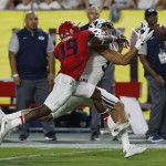 Arizona cornerback DaVonte' Neal (19) breaks up the pass intended for BYU wide receiver Nick Kurtz during the first half of an NCAA college football game, Saturday, Sept. 3, 2016, in Phoenix. (AP Photo/Rick Scuteri)
