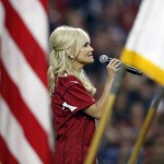 Actress and singer Kristin Chenoweth performs the national anthem prior to an NFL football game between the New England Patriots and the Arizona Cardinals, Sunday, Sept. 11, 2016, in Glendale, Ariz. (AP Photo/Ross D. Franklin)