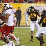 Texas Tech's Patrick Mahomes II, left, scores a touchdown as he beats Arizona State's Tyler Whiley (23) and Koron Crump (4) during the first half of an NCAA college football game Saturday, Sept. 10, 2016, in Tempe, Ariz. (AP Photo/Ross D. Franklin)