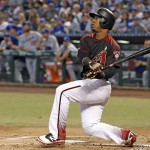 Arizona Diamondbacks' Jean Segura watches the flight of his home run against the Los Angeles Dodgers during the first inning of a baseball game Saturday, Sept. 17, 2016, in Phoenix. (AP Photo/Ross D. Franklin)