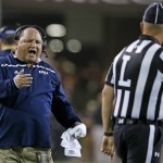 Northern Arizona coach Jerome Souers, left, argues with line judge Steven Kovac during the first half of an NCAA college football game against Arizona State on Saturday, Sept. 3, 2016, in Tempe, Ariz. (AP Photo/Ross D. Franklin)