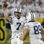 BYU quarterback Taysom Hill (7) throws to tight end Tanner Balderree for a first down during the first half of an NCAA college football game against Arizona, Saturday, Sept. 3, 2016, in Phoenix. (AP Photo/Rick Scuteri)