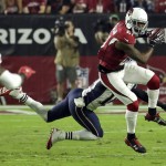 Arizona Cardinals cornerback Patrick Peterson (21) intercepts a pass intended for New England Patriots wide receiver Matthew Slater (18) during the first half of an NFL football game, Sunday, Sept. 11, 2016, in Glendale, Ariz. (AP Photo/Rick Scuteri)