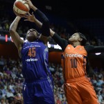Phoenix Mercury's Kelsey Bone, left, goes up for a basket against Connecticut Sun's Courtney Williams, right, during the second half of a WNBA basketball game, Friday, Sept. 2, 2016, in Uncasville, Conn. (AP Photo/Jessica Hill)