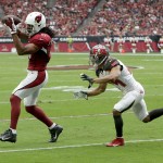 Arizona Cardinals wide receiver Larry Fitzgerald (11) pulls in a pass as Tampa Bay Buccaneers cornerback Brent Grimes (24) defends during the first half of an NFL football game, Sunday, Sept. 18, 2016, in Glendale, Ariz. (AP Photo/Rick Scuteri)