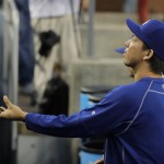 Los Angeles Dodgers starting pitcher Kenta Maeda, of Japan, tosses the ball back to a fan before a baseball game against the Arizona Diamondbacks, Wednesday, Sept. 7, 2016, in Los Angeles. (AP Photo/Jae C. Hong)