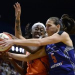 Connecticut Sun's Chiney Ogwumike, left, and Phoenix Mercury's Sonja Petrovic, right, battle for a rebound during the first half of a WNBA basketball game, Friday, Sept. 2, 2016, in Uncasville, Conn. (AP Photo/Jessica Hill)