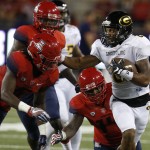 Grambling State wide receiver Dominique Leake, right, fends off Arizona safety Demetrius Flannigan-Fowles, left, during the second half of an NCAA college football game, Saturday, Sept. 10, 2016, in Tucson, Ariz. Arizona defeated Grambling State 31-21. (AP Photo/Rick Scuteri)