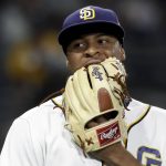 San Diego Padres starting pitcher Luis Perdomo bites his glove as he leave the field during the sixth inning of a baseball game against the Arizona Diamondbacks in San Diego, Wednesday, Sept. 21, 2016. Perdomo gave up a two-run home run to Arizona Diamondbacks' Paul Goldschmidt in the sixth. (AP Photo/Chris Carlson)