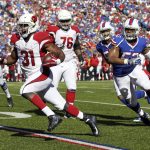 Arizona Cardinals running back David Johnson (31) runs past Buffalo Bills inside linebacker Preston Brown (52) for a touchdown during the second half of an NFL football game on Sunday, Sept. 25, 2016, in Orchard Park, N.Y. (AP Photo/Jeffrey T. Barnes)