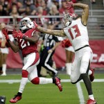 Arizona Cardinals cornerback Patrick Peterson (21) intercepts a pass intended for Tampa Bay Buccaneers wide receiver Mike Evans (13) during the first half of an NFL football game, Sunday, Sept. 18, 2016, in Glendale, Ariz. (AP Photo/Rick Scuteri)