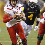 Texas Tech's Patrick Mahomes II, left, runs with the ball as he gets past Arizona State's Koron Crump (4) during the first half of an NCAA college football game Saturday, Sept. 10, 2016, in Tempe, Ariz. (AP Photo/Ross D. Franklin)