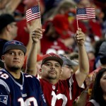 Arizona Cardinals and New England Patriots fans cheer during the first half of an NFL football game, Sunday, Sept. 11, 2016, in Glendale, Ariz. (AP Photo/Ross D. Franklin)