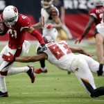 Arizona Cardinals defensive back Marcus Cooper (41) intercepts a ball intended for Tampa Bay Buccaneers wide receiver Vincent Jackson (83) during the first half of an NFL football game, Sunday, Sept. 18, 2016, in Glendale, Ariz. (AP Photo/Ross D. Franklin)