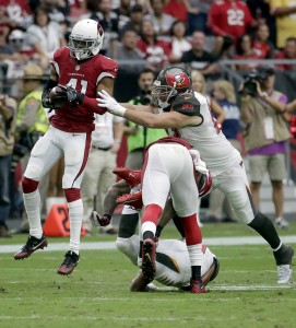 Arizona Cardinals defensive back Marcus Cooper (41) intecepts a pass for a touchdown as Tampa Bay Buccaneers tight end Brandon Myers (82) defends during the second half of an NFL football game, Sunday, Sept. 18, 2016, in Glendale, Ariz. (AP Photo/Rick Scuteri)