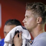 Los Angeles Dodgers' Brock Stewart wipes sweat from his face after pitching during the fifth inning of a baseball game against the Arizona Diamondbacks Saturday, Sept. 17, 2016, in Phoenix. (AP Photo/Ross D. Franklin)