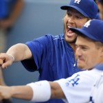 Los Angeles Dodgers' Clayton Kershaw, left, and Enrique Hernandez joke around in the dugout prior to the team's baseball game against the Arizona Diamondbacks, Monday, Sept. 5, 2016, in Los Angeles. (AP Photo/Mark J. Terrill)