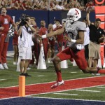 Arizona quarterback Brandon Dawkins scores a first half touchdown during an NCAA college football game against Hawaii, Saturday, Sept. 17, 2016, in Tucson, Ariz. (AP Photo/Rick Scuteri)