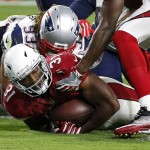 Arizona Cardinals running back David Johnson (31) scores a touchdown as New England Patriots defensive end Jabaal Sheard (93) defends during the second half of an NFL football game, Sunday, Sept. 11, 2016, in Glendale, Ariz. (AP Photo/Ross D. Franklin)
