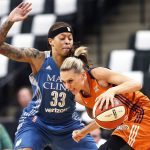 Phoenix Mercury's' Penny Taylor, right, drives round Minnesota Lynx's Seimone Augustus in the first quarter of a WNBA playoff semi-finals basketball game Wednesday, Sept. 28, 2016, in St. Paul, Minn. (AP Photo/Jim Mone)