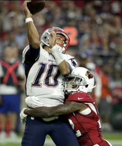 New England Patriots quarterback Jimmy Garoppolo (10) is hit as he throws by Arizona Cardinals strong safety Tony Jefferson (22) during the first half of an NFL football game, Sunday, Sept. 11, 2016, in Glendale, Ariz. (AP Photo/Rick Scuteri)