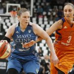 Phoenix Mercury's' Diana Taurasi, right, tries to reach the ball as Minnesota Lynx's Lindsay Whalen drives in the first quarter of a WNBA playoff semi-finals basketball game Wednesday, Sept. 28, 2016, in St. Paul, Minn. (AP Photo/Jim Mone)